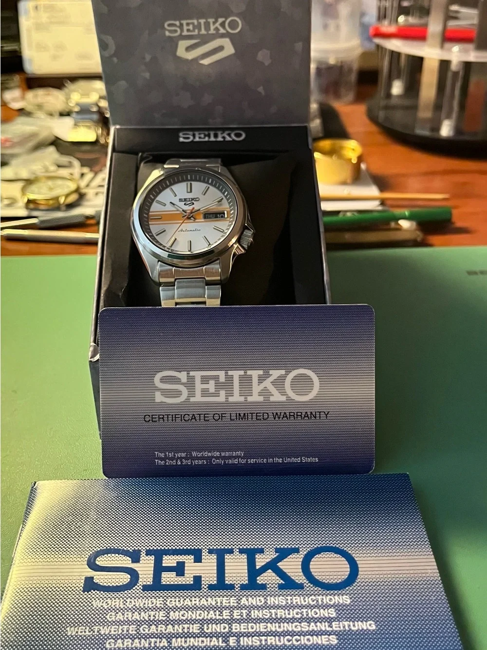Seiko : RETRO GT Silver Watch with Orange Stripe and Orange Seconds Hand SRPE51